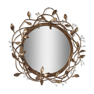 Round mirror in gilded wrought iron and leaves