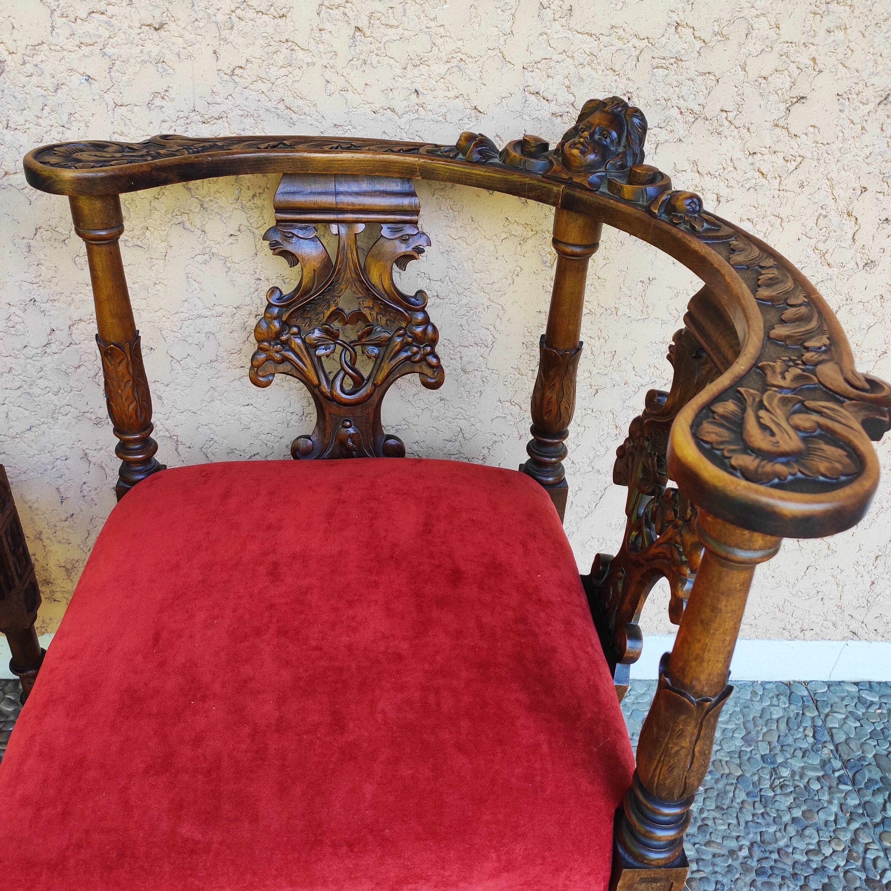 Pair of neo-Renaissance Henri II corner armchairs in carved wood, 19th century.