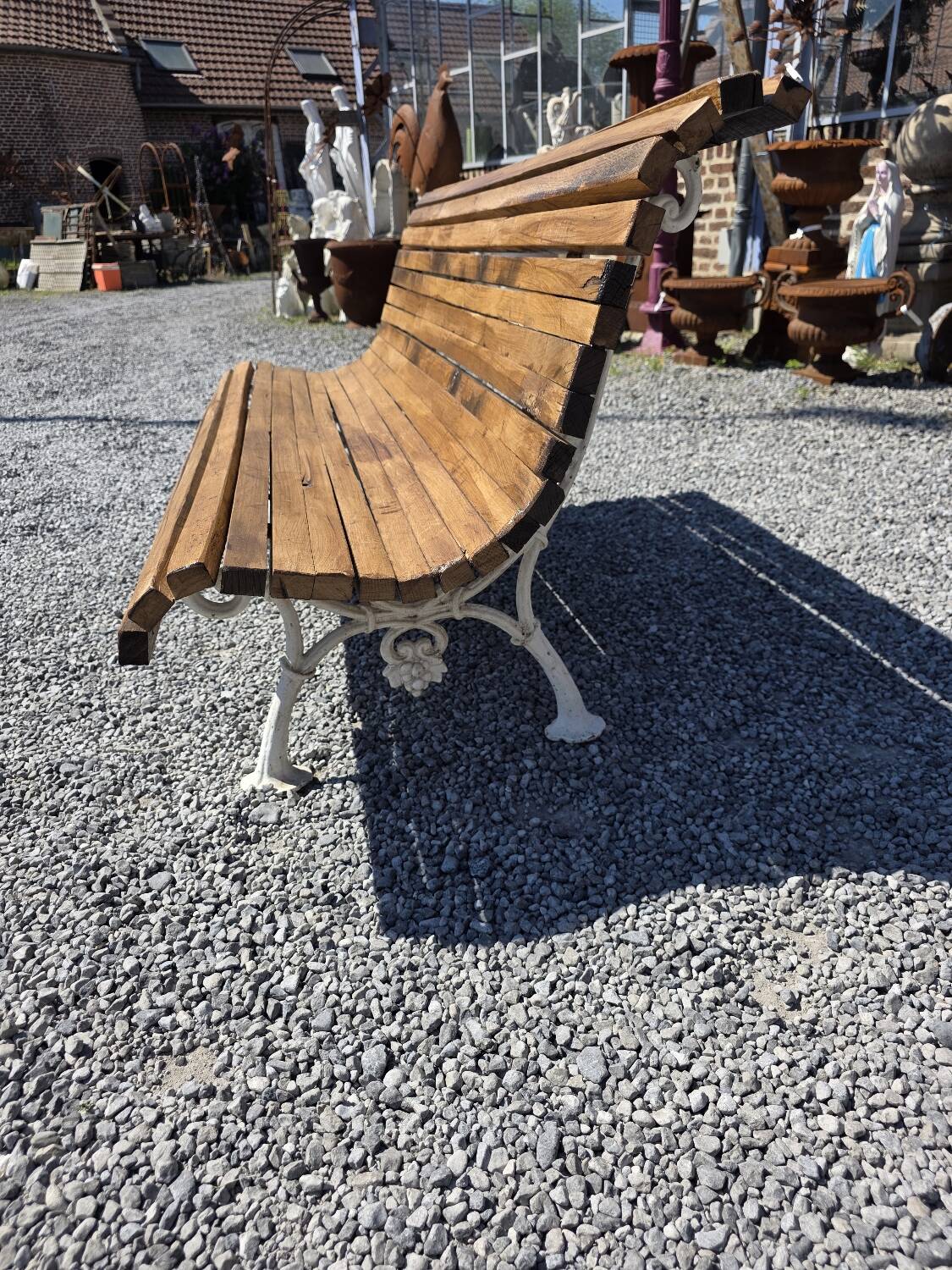 Antique garden bench made of cast iron and oak slats