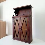 Small antique wall cabinet in Gothic style.