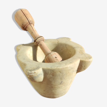 Marble mortar and wooden pestle from the 19th century.