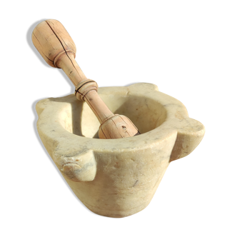 Marble mortar and wooden pestle from the 19th century.