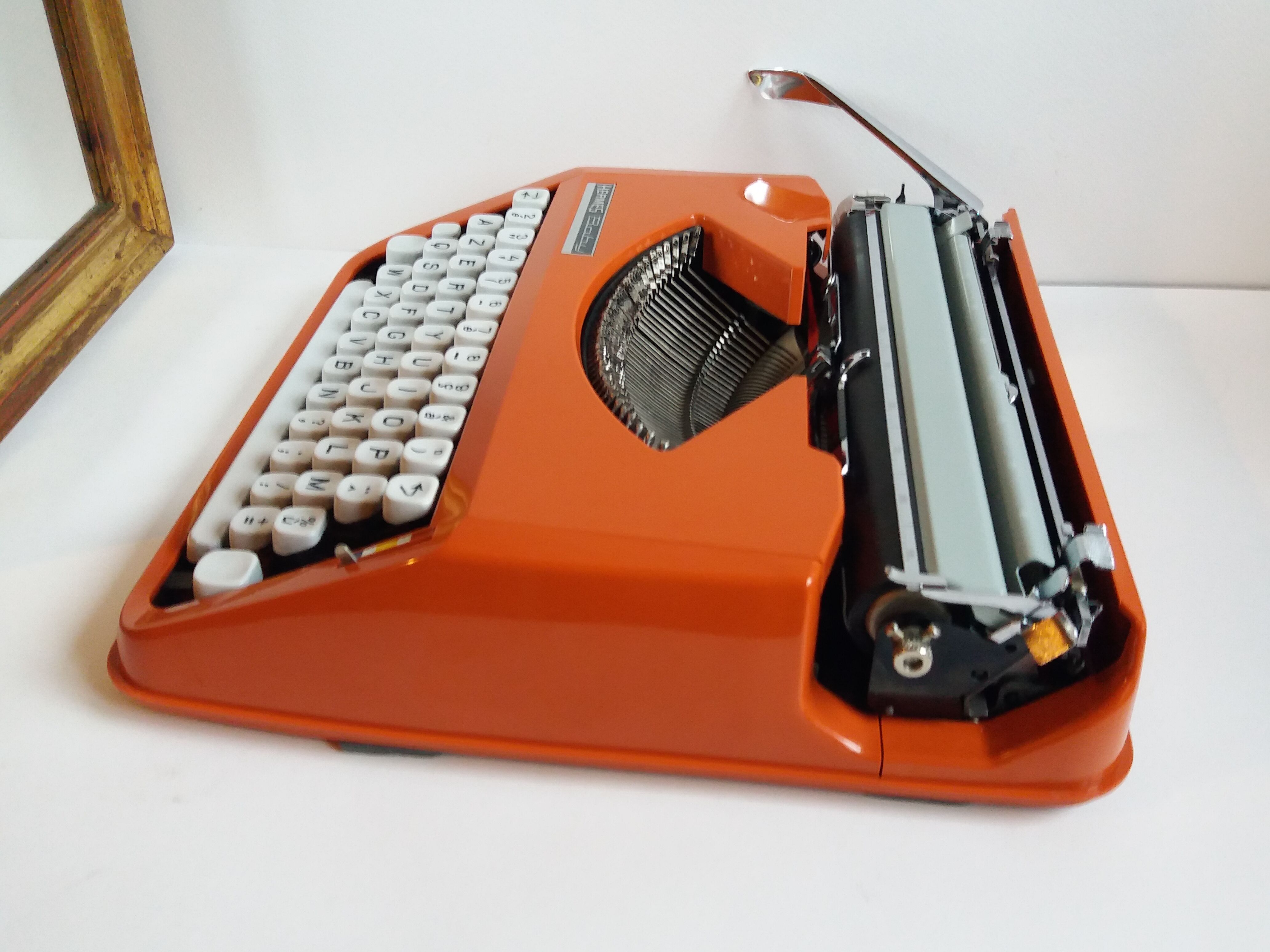 Hermes Baby orange typewriter