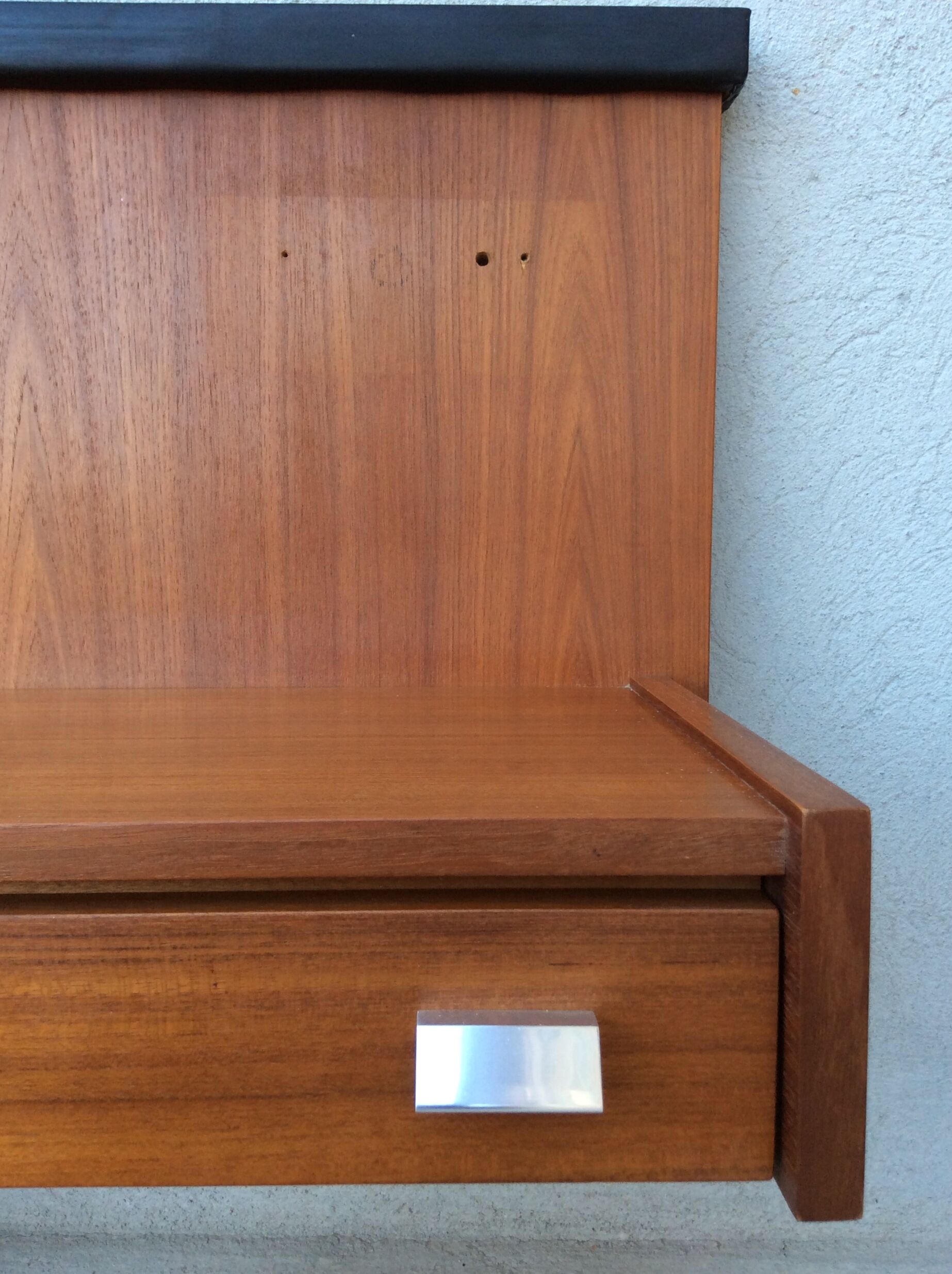 Scandinavian-style teak bed with integrated nightstands