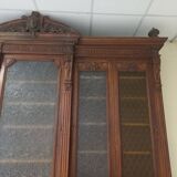 Glass-fronted walnut bookcase