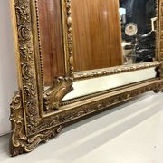 Large antique pediment mirror with mouldings.