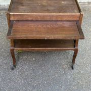 Extendable wooden bar trolley with a glass top from the 1930s.