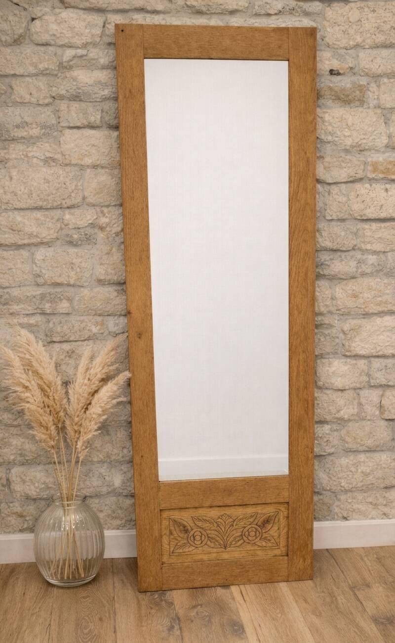 Restored old wardrobe door in a cheval mirror / freestanding mirror.