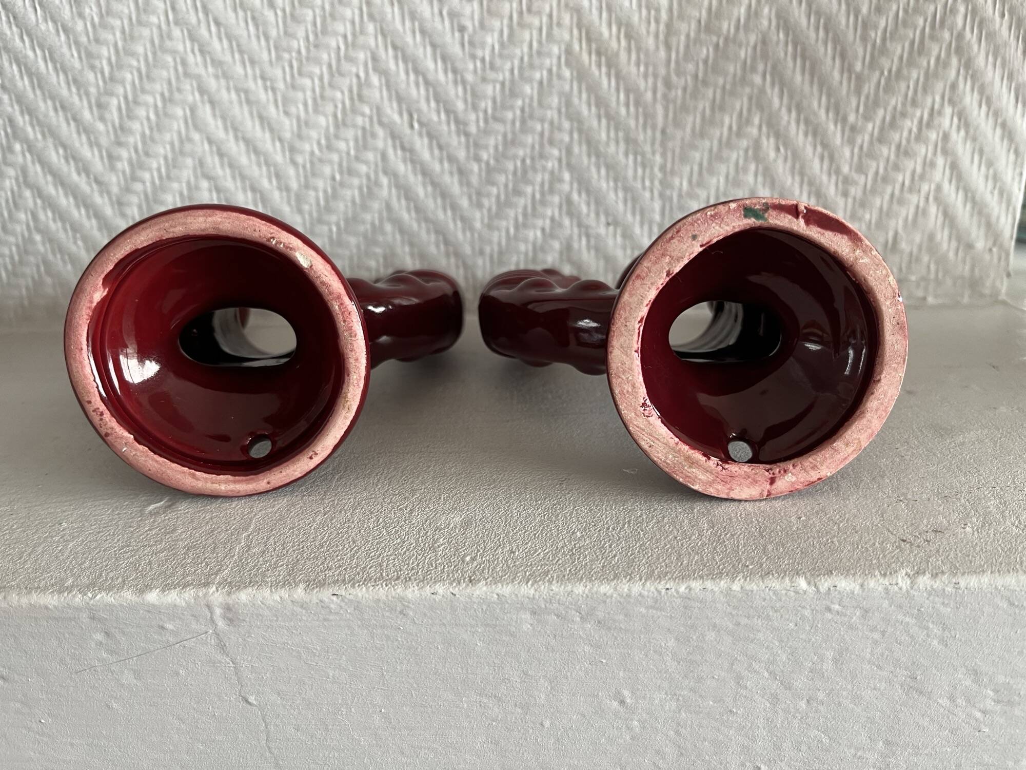 2 fifties red ceramic candle holders, horseshoe pattern