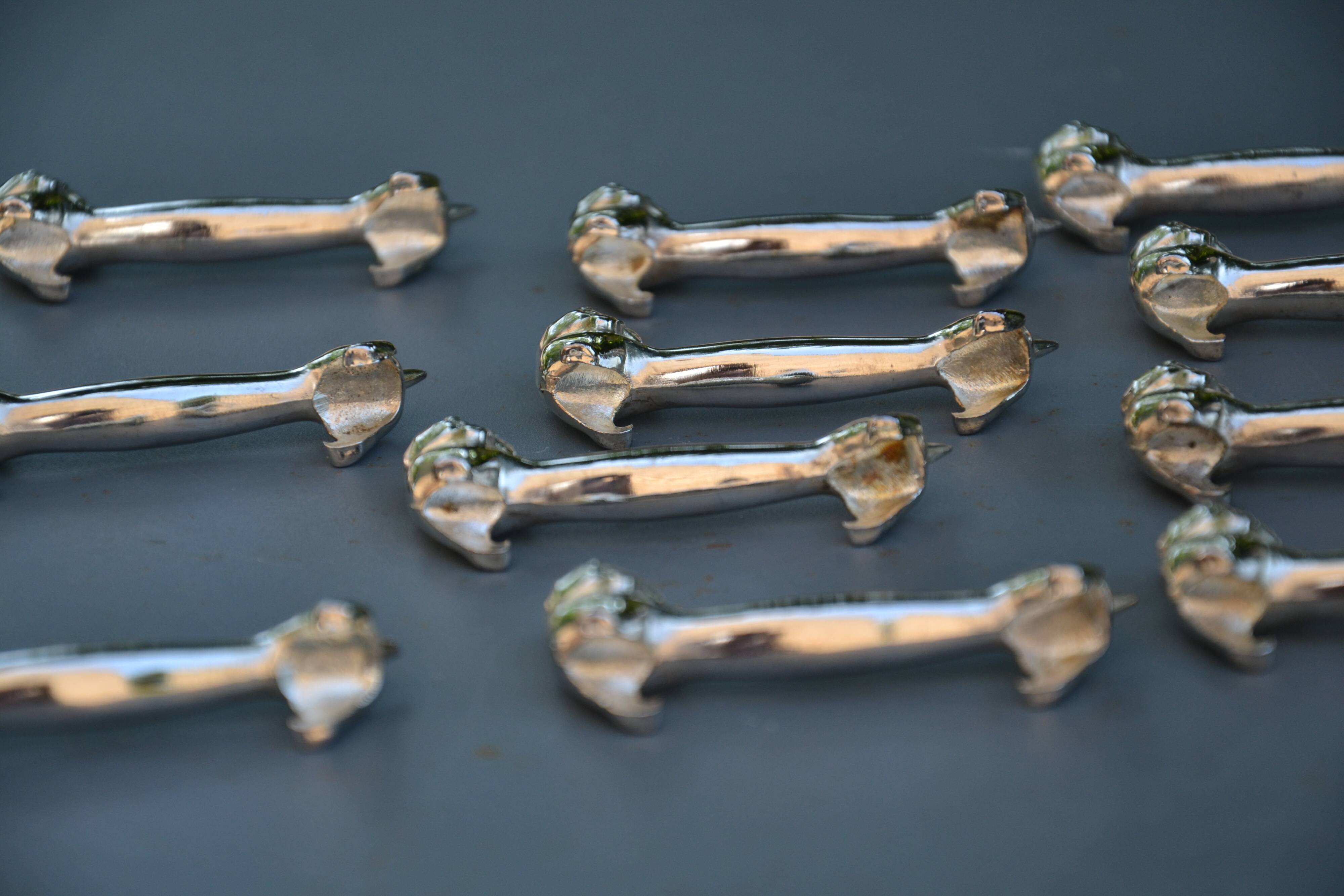 12 silver-plated cat knife rests