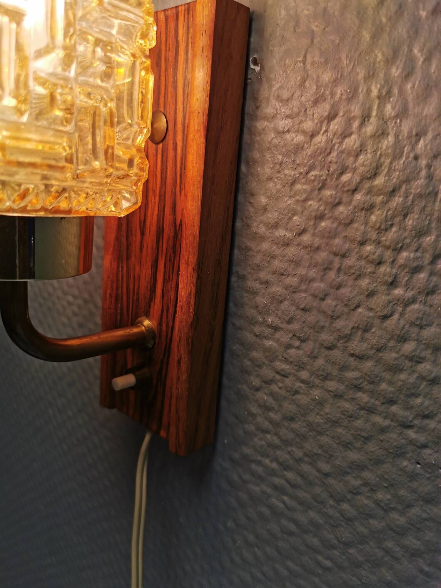 Small, stylish wall lamp with rosewood suspension and hard pressed glass