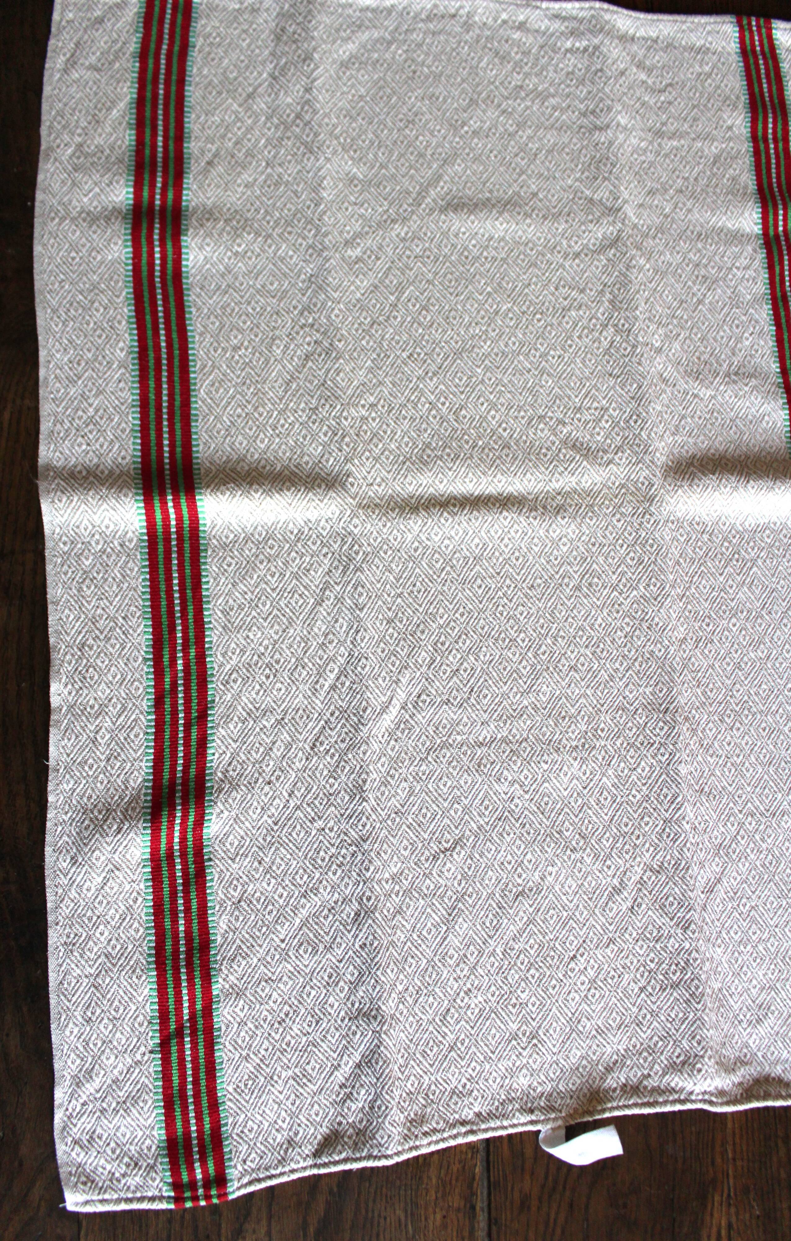 Old chevron towel with red and green stripes.