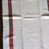 Old chevron towel with red and green stripes.