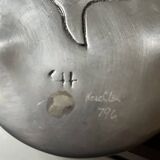 polished aluminum pocket emptier, signed and stamped in the mass