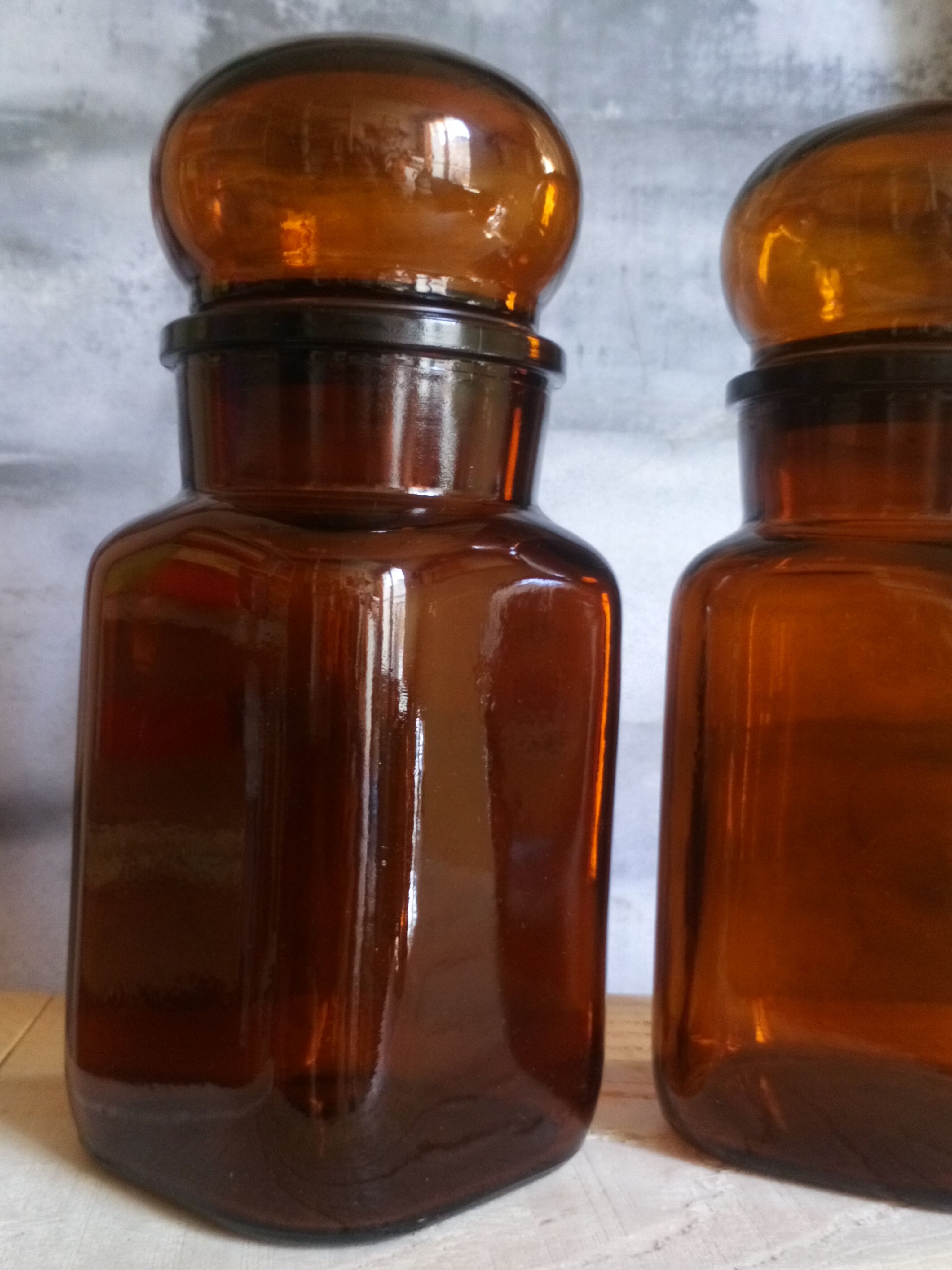 Duo of vintage apothecary bottles in amber glass