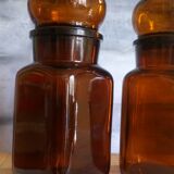 Duo of vintage apothecary bottles in amber glass