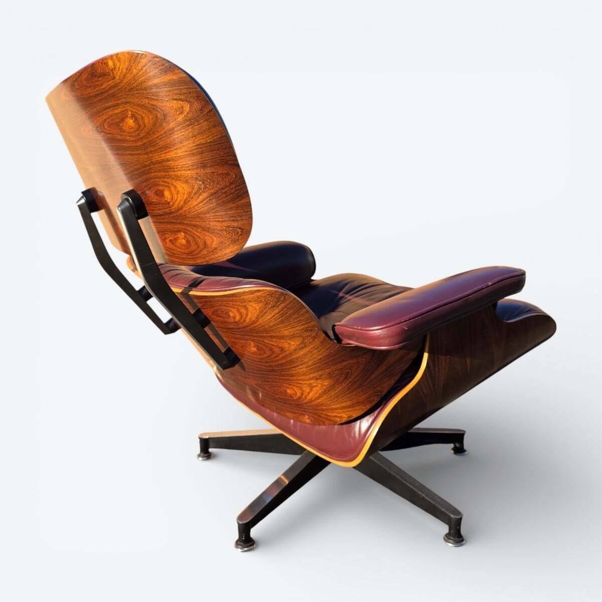Original Eames lounge chair by Herman Miller in burgundy rosewood.