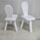 Pair of tripod chairs, gouged seats. Brutalist, circa 1960. Painted wood.