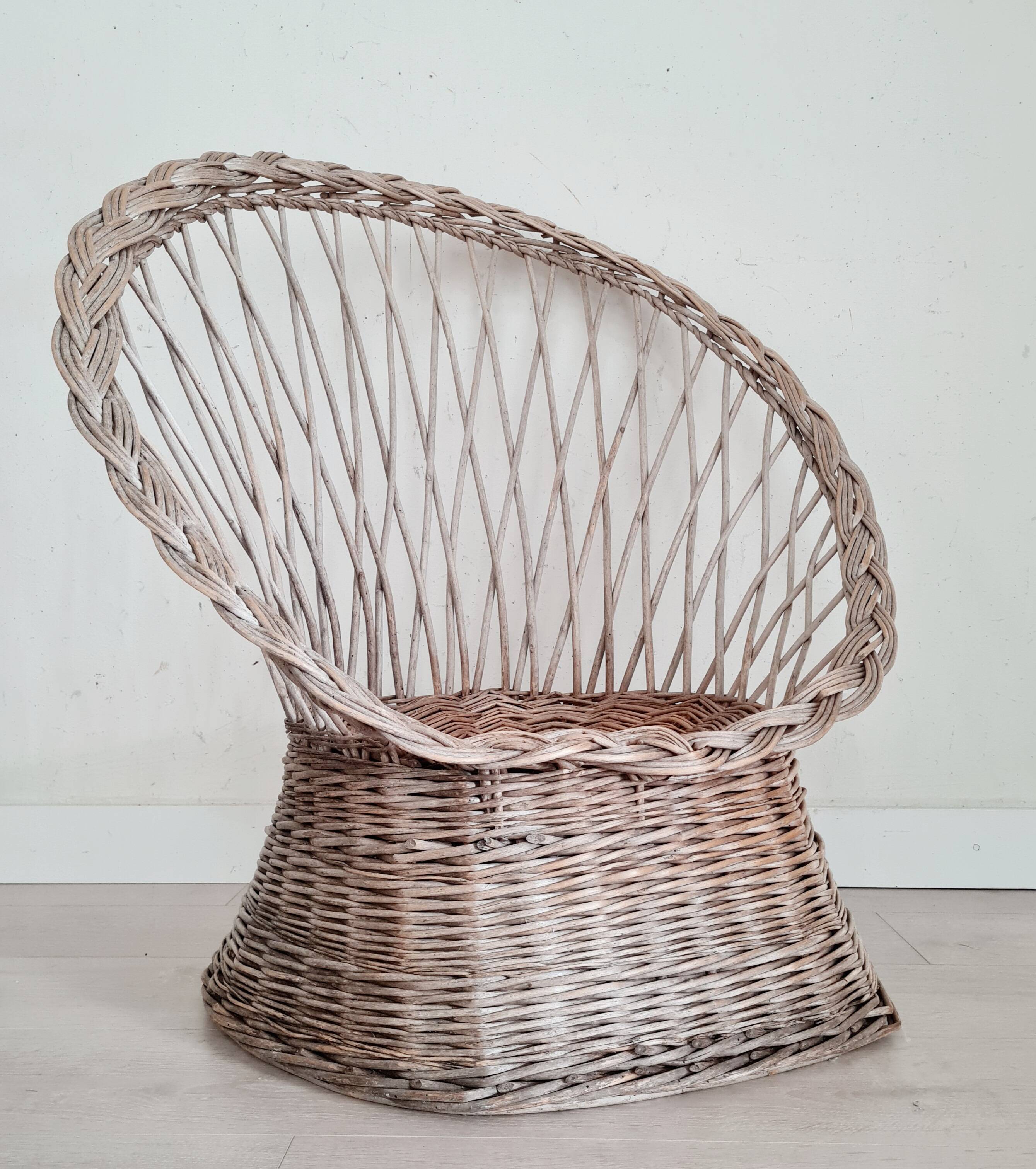 Antique armchair in gray woven wicker