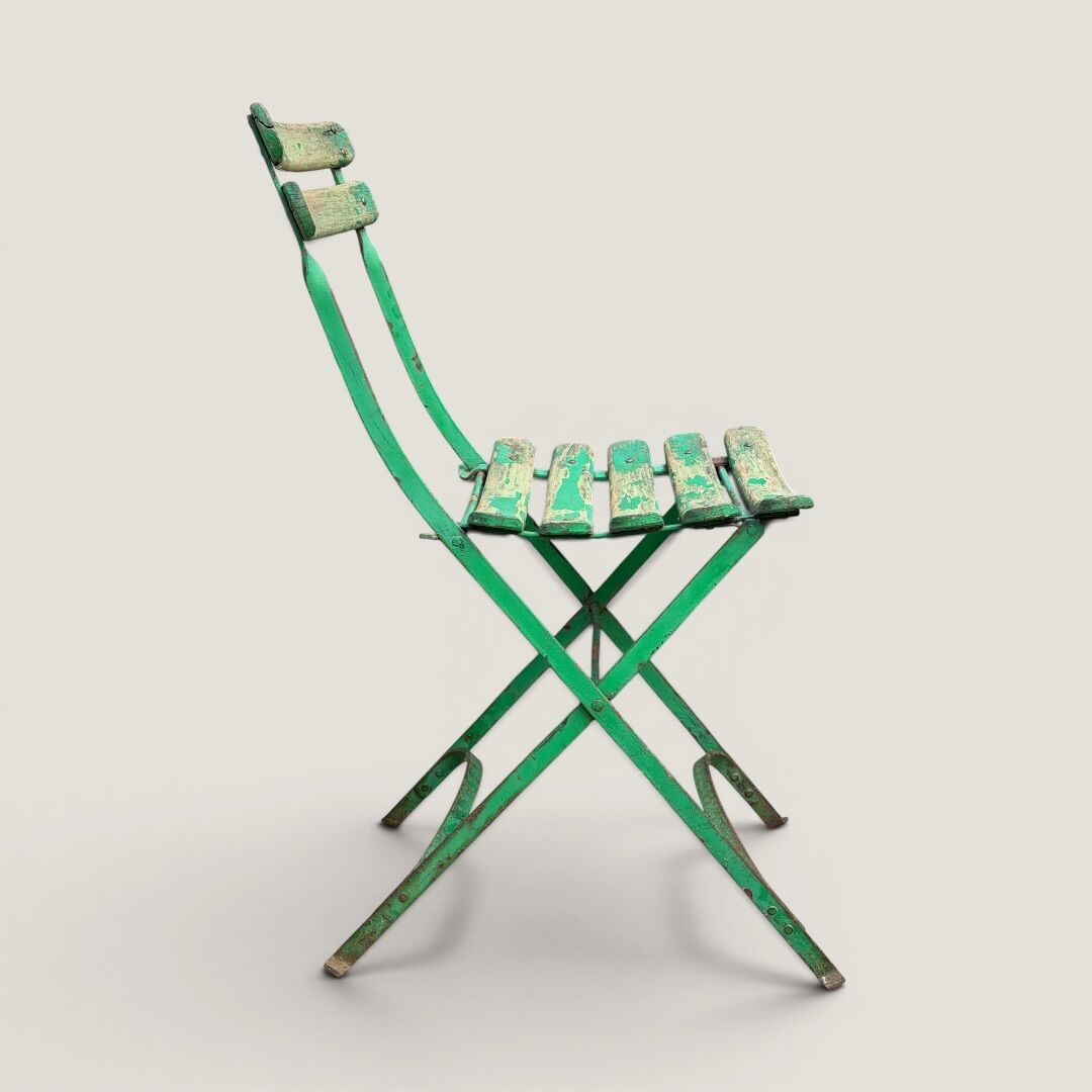 Bistro tables and folding chairs with a patina from the original 1930s.
