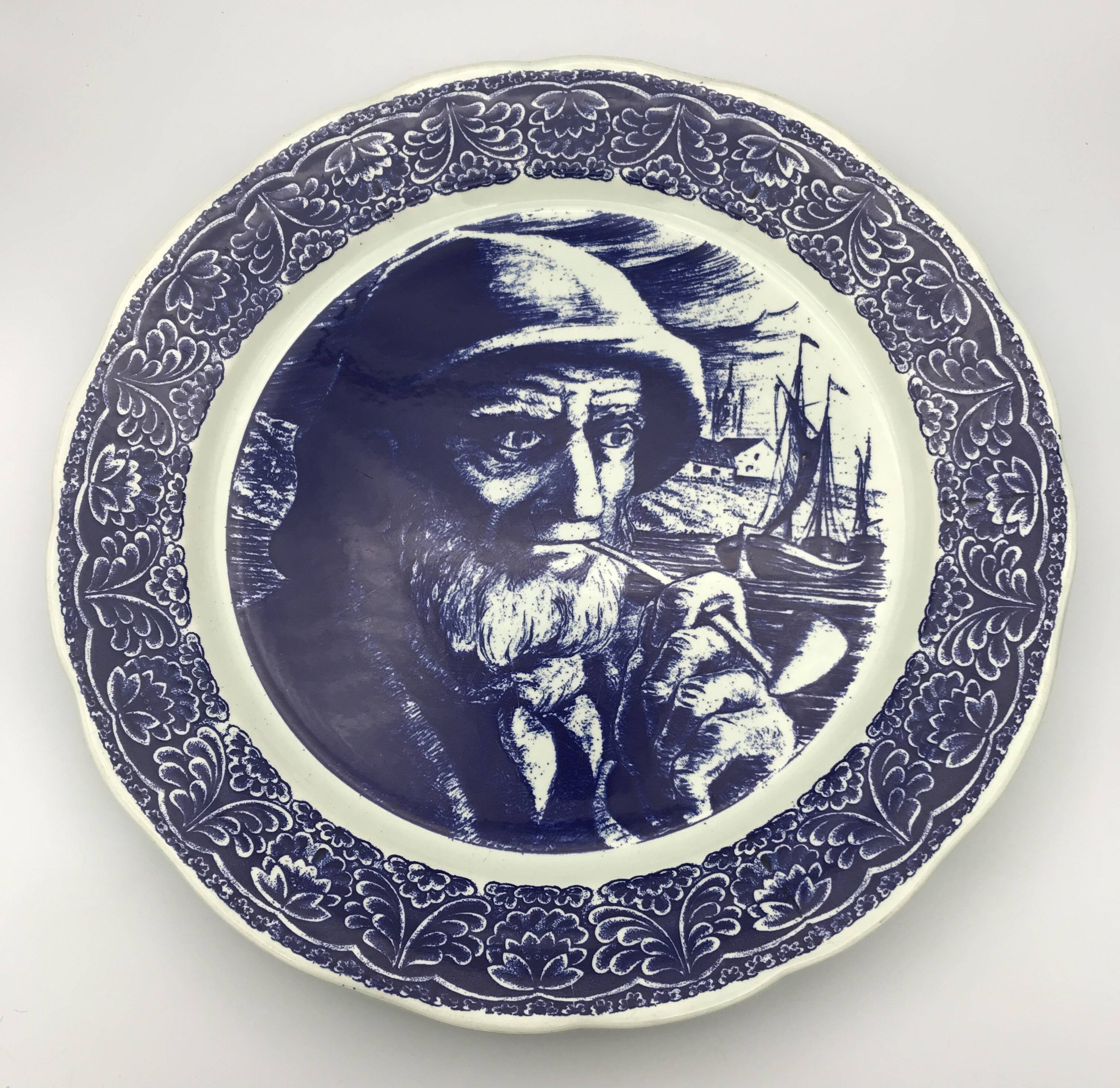 Blue enamelled earthenware wall plate with fisherman decor, Boch La Louvière, Belgium