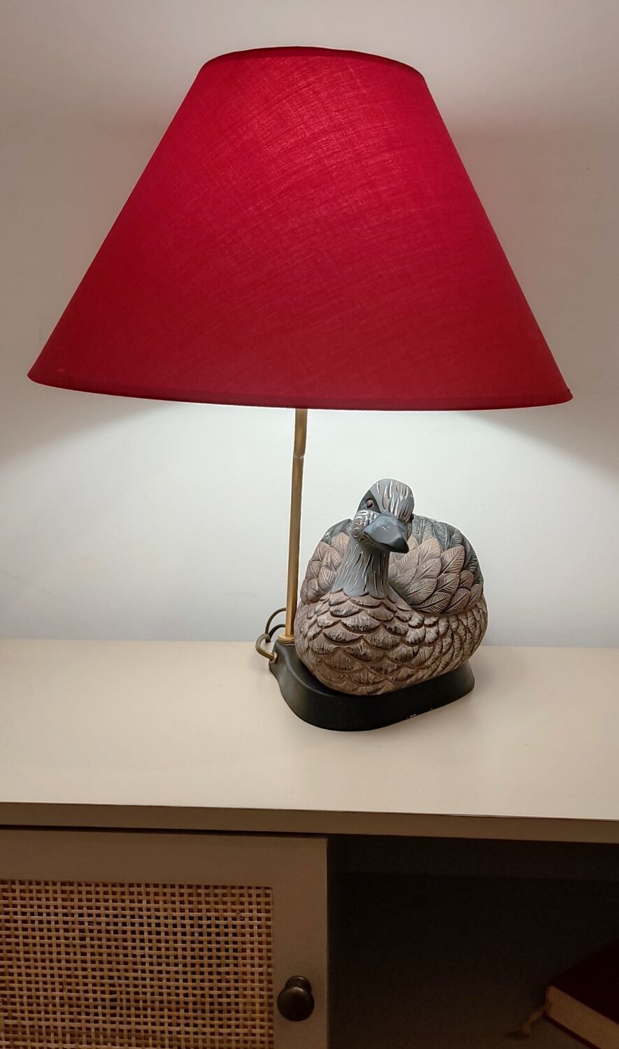 Decorative table lamp with a sculpted duck-shaped base and painted finish.