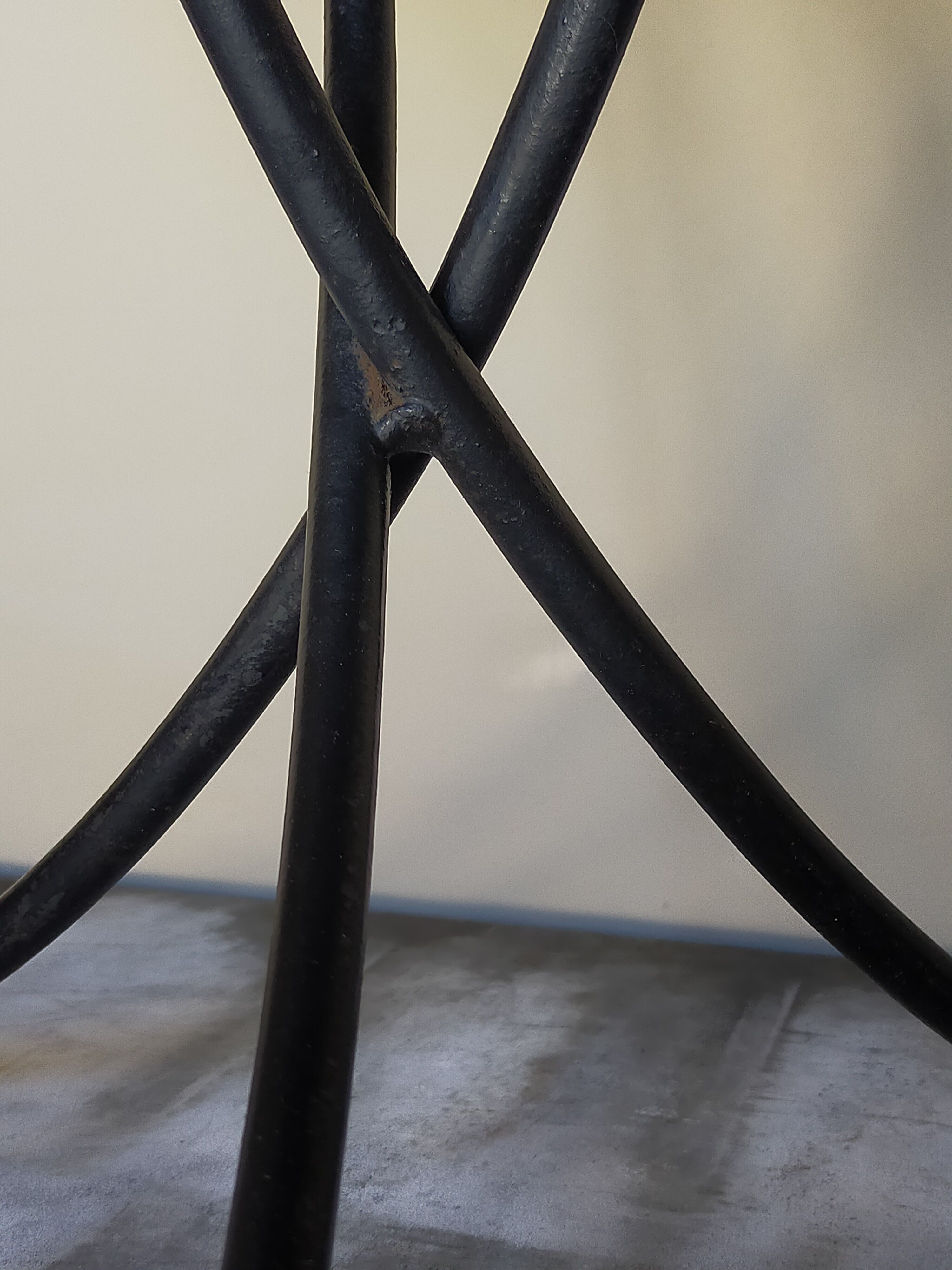 Wrought iron tripod healing in the 1950s
