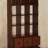 Pair of open bookshelves in crocodile leather with drawers and compartments.