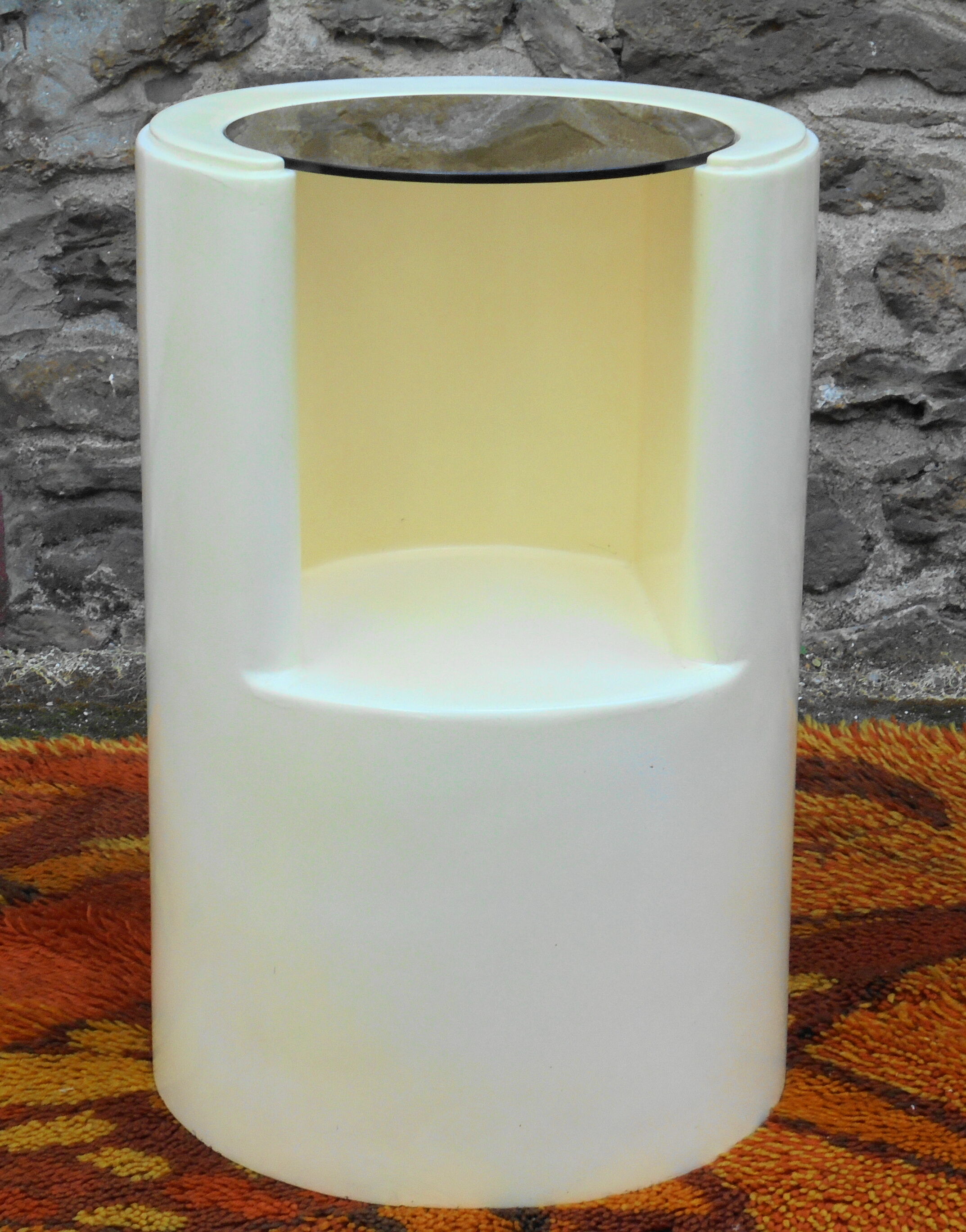 Cylindrical fiberglass bedside table from the 60s