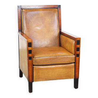 Fauteuil en cuir de mouton et bois au design Art Déco