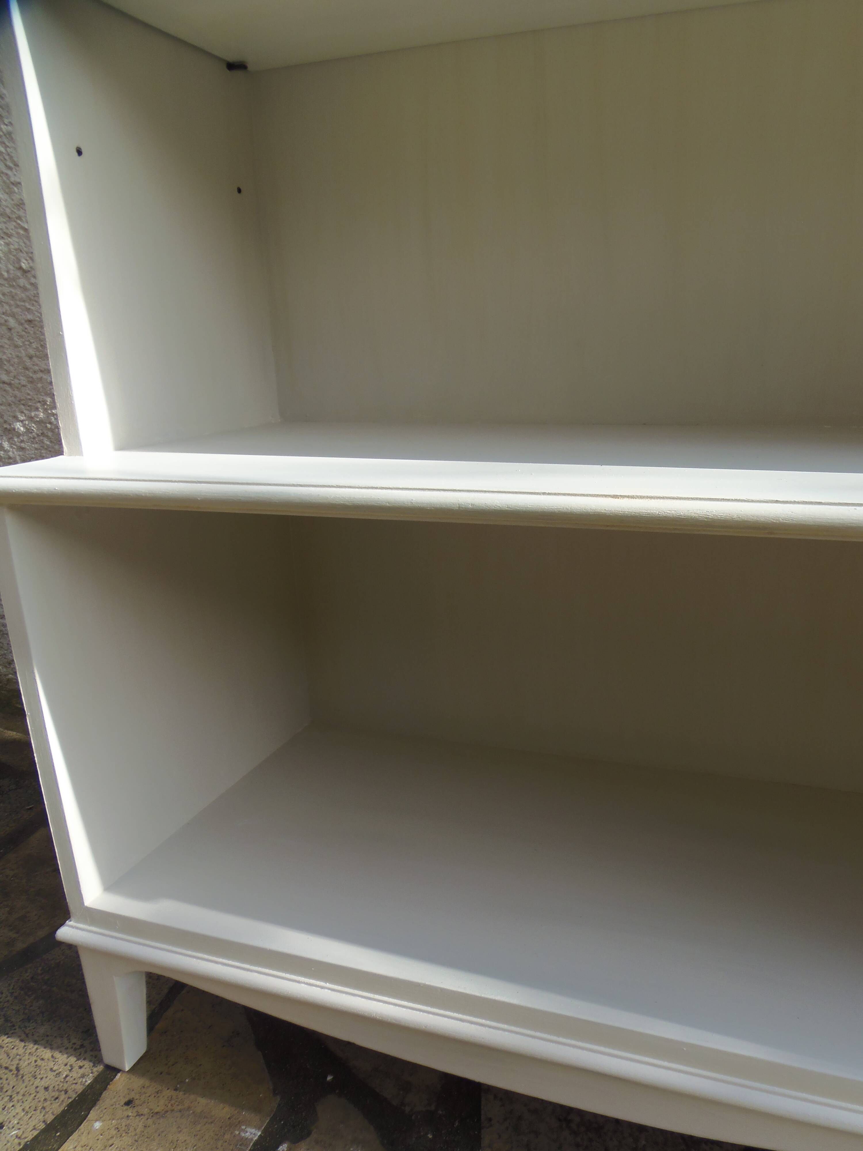 Vintage library enhanced in beige, wooden top.