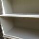 Vintage library enhanced in beige, wooden top.