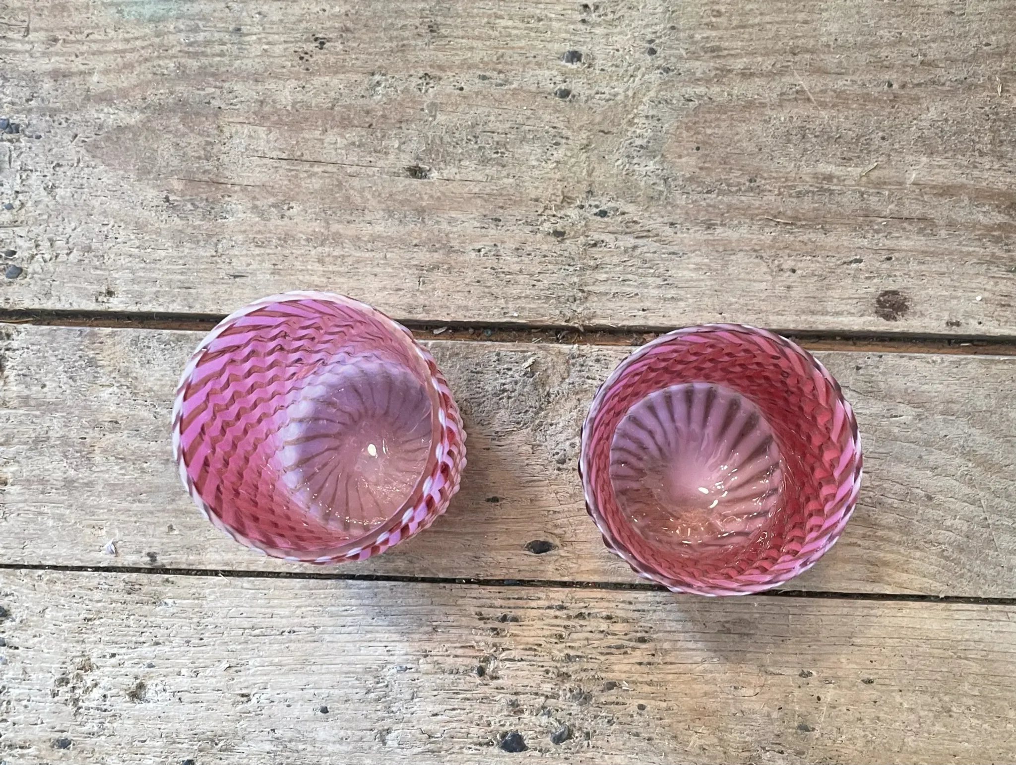 Two Northwood glasses from the 1930s in opalescent pink glass.