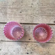 Two Northwood glasses from the 1930s in opalescent pink glass.