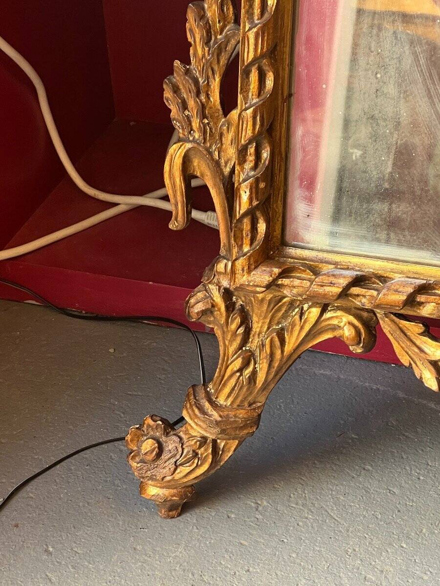 Antique mirror above a chest of drawers or between two windows, carved wood, 18th century