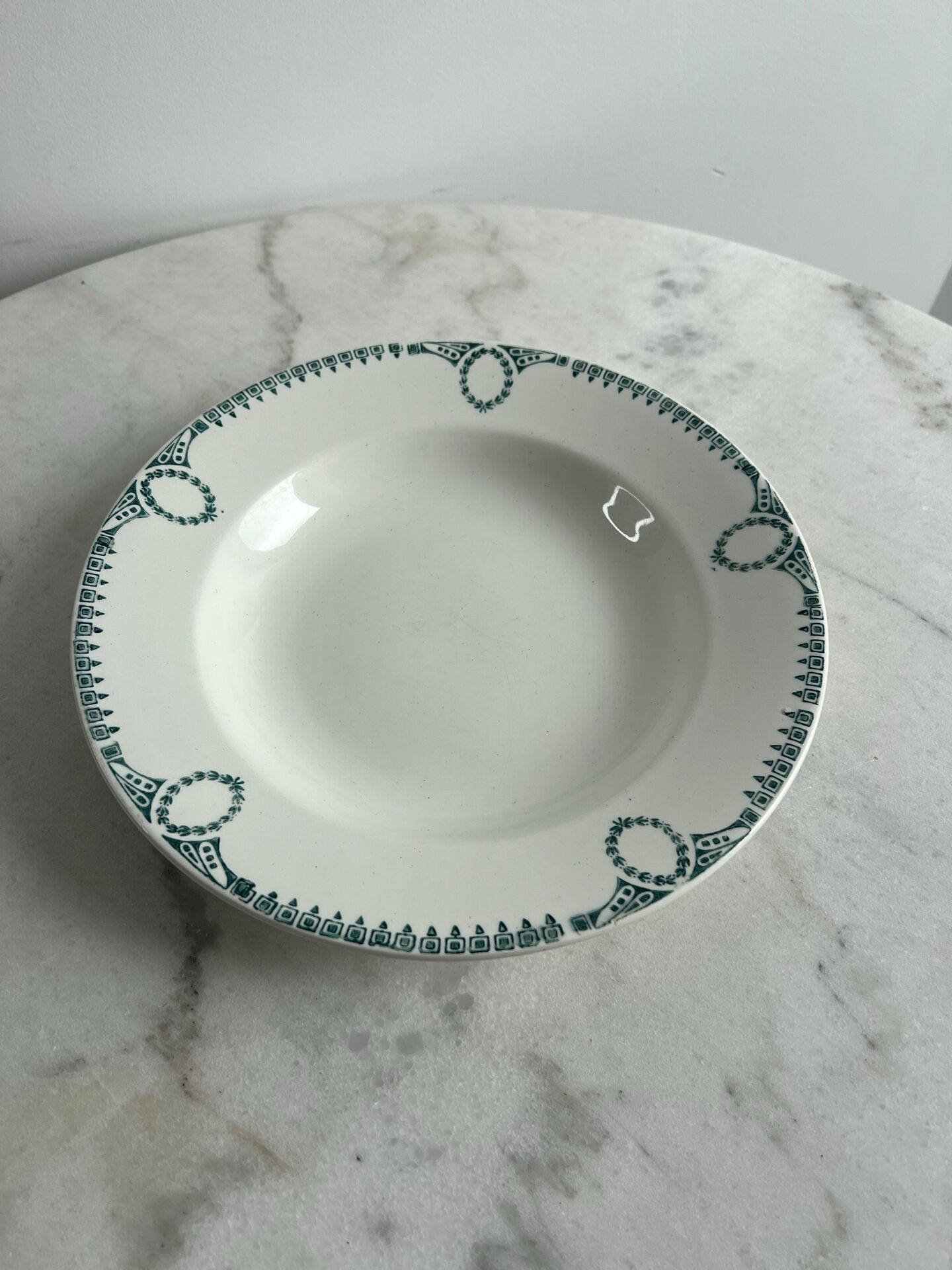 Céranord Saint Amand deep plate with green crown decoration.