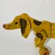 Toy old dog sausage dachshund to drag wooden