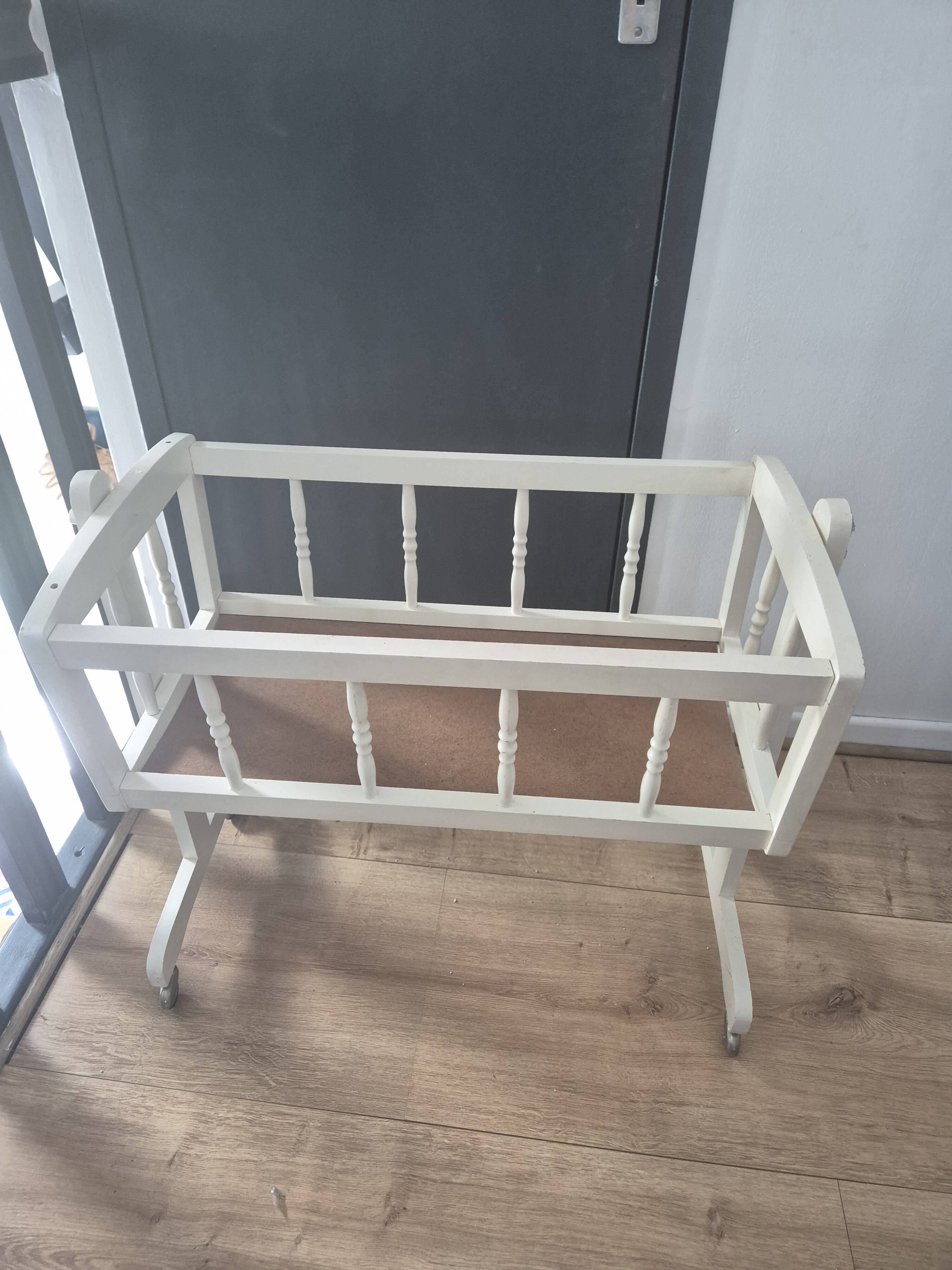 white wooden rocking cradle for baby or doll