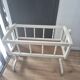 white wooden rocking cradle for baby or doll