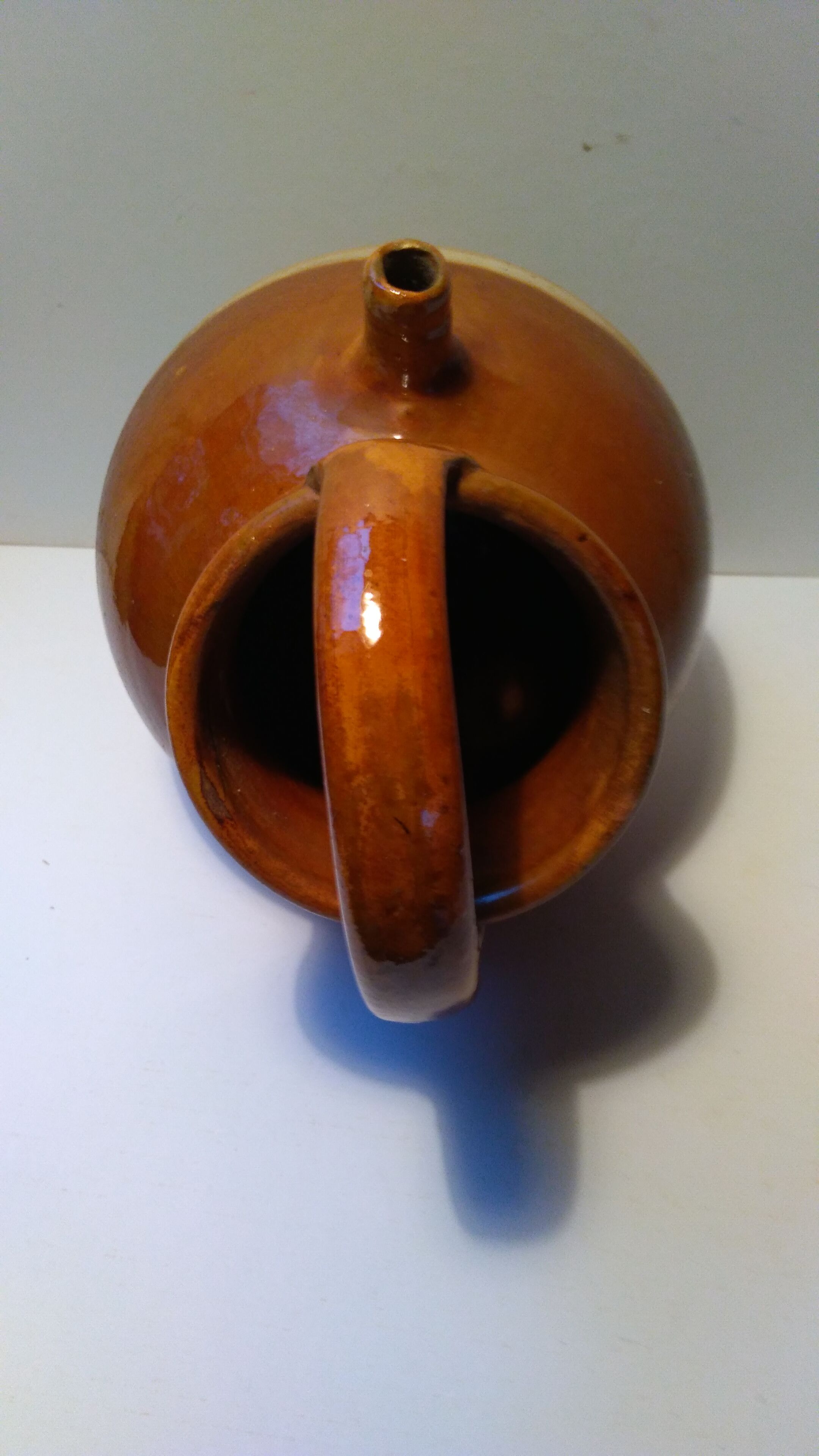 Old glazed earth jug