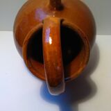 Old glazed earth jug