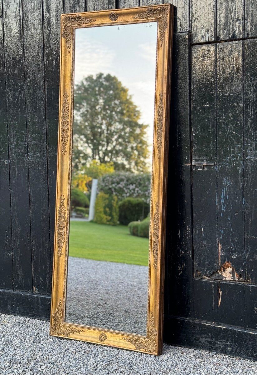 Miroir Empire en bois stuqué et doré, début XIXème siècle