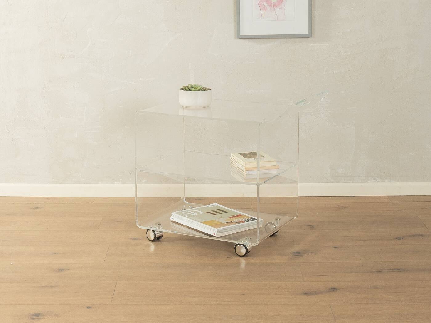 Wonderful side table from the 1960s, high-quality frame and shelf made of transparent acrylic with chrome-plated castors