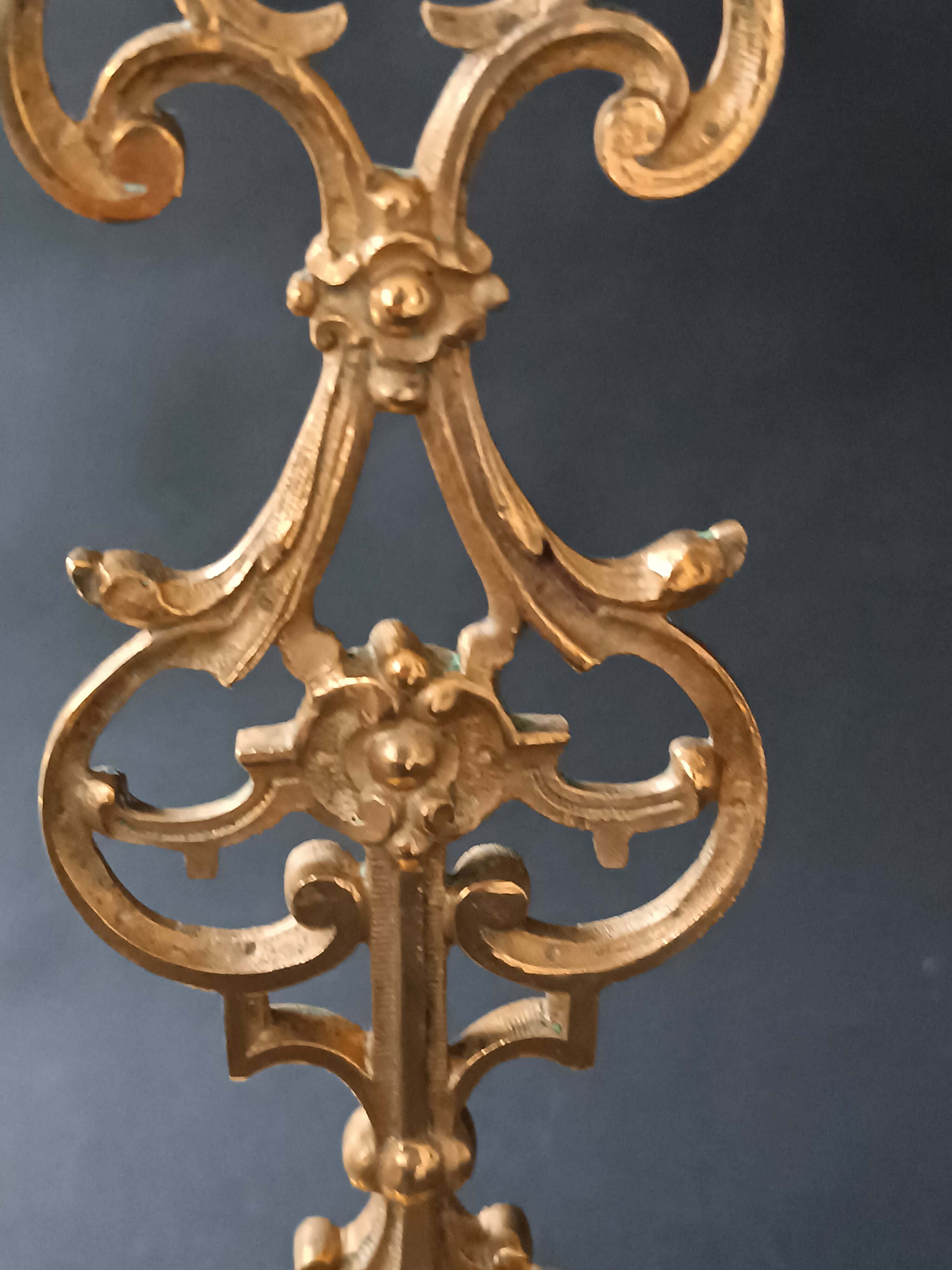 Antique three-light openwork brass church candelabrum.