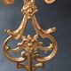 Antique three-light openwork brass church candelabrum.