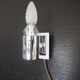 Transparent and white glass torch-type wall light.