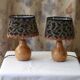 Pair of bedside lamps in pear wood with leopard shade.