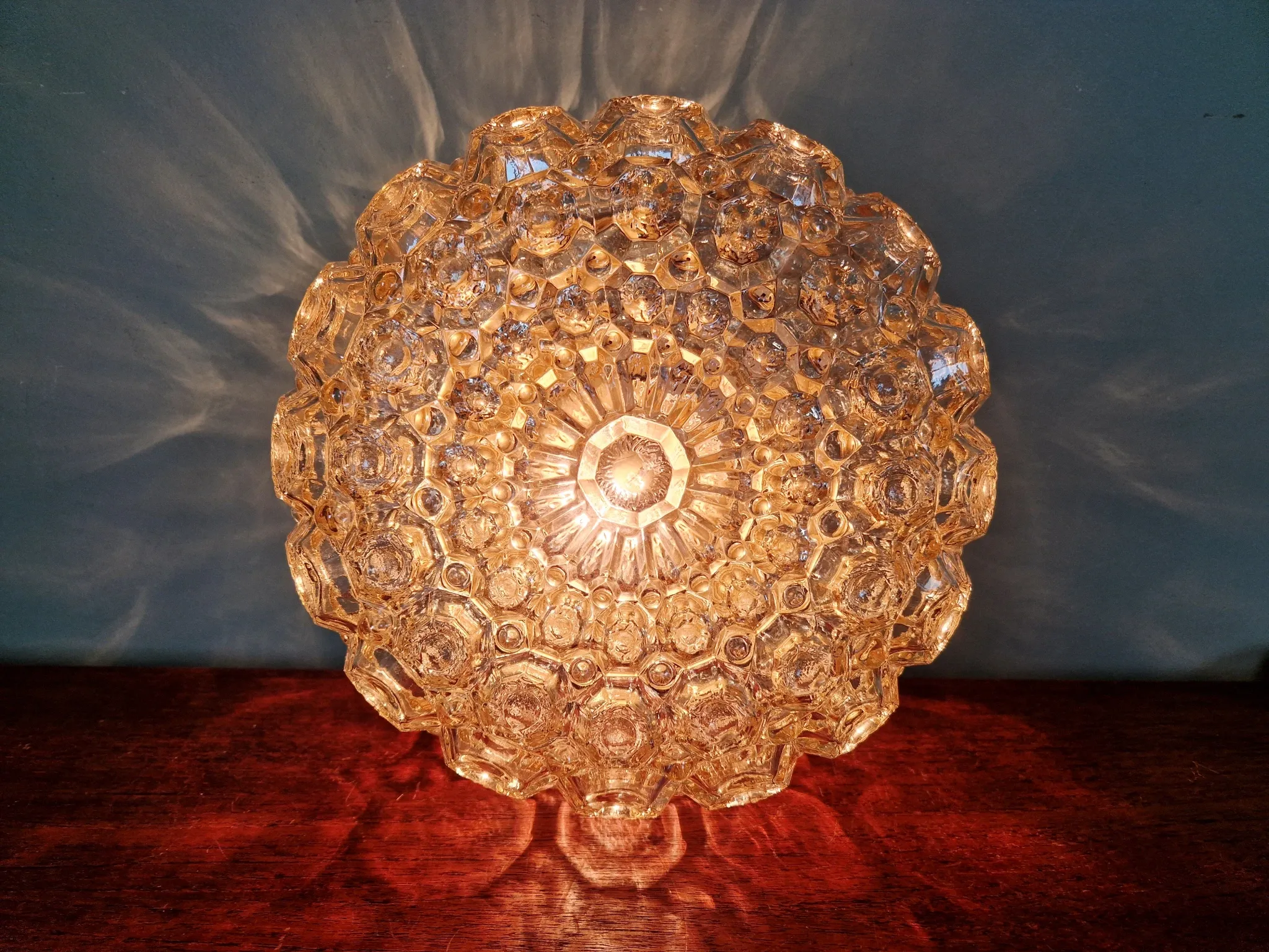 Amber glass honeycomb ceiling light, design by Helena Tynell, 1970.