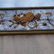 50s Eglomisé glass mirror with musical instrument decor