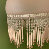 Globe pendant with pink tassels